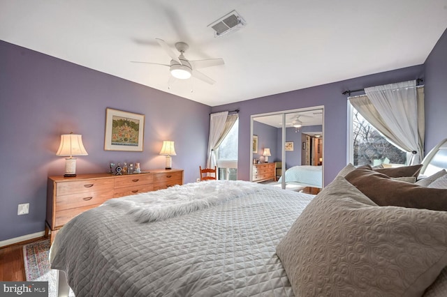 bedroom featuring a closet, hardwood / wood-style floors, and ceiling fan