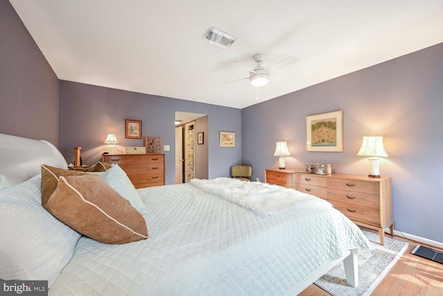 bedroom with light wood-type flooring and ceiling fan