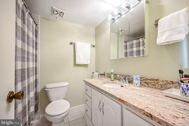 bathroom with toilet, walk in shower, vanity, and tile patterned floors