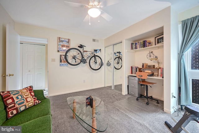 home office with carpet flooring and ceiling fan