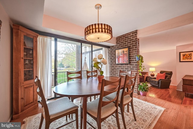 dining room with hardwood / wood-style flooring