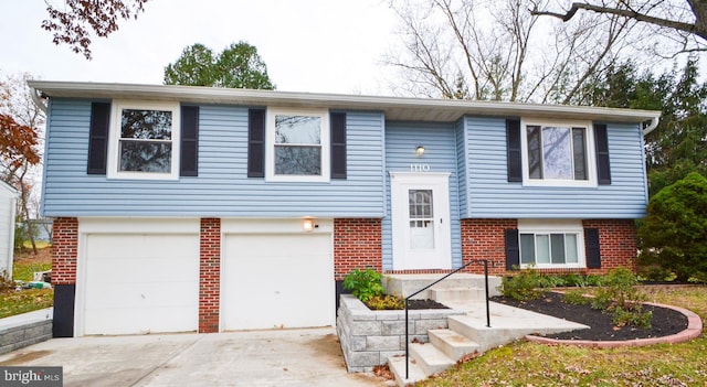 split foyer home featuring a garage