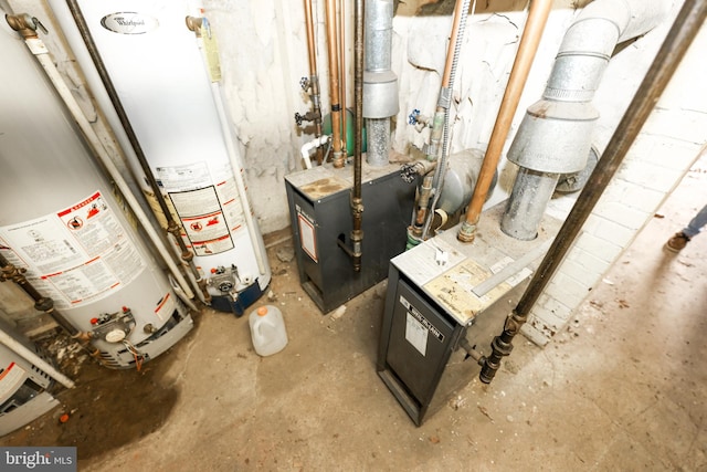 utility room featuring gas water heater