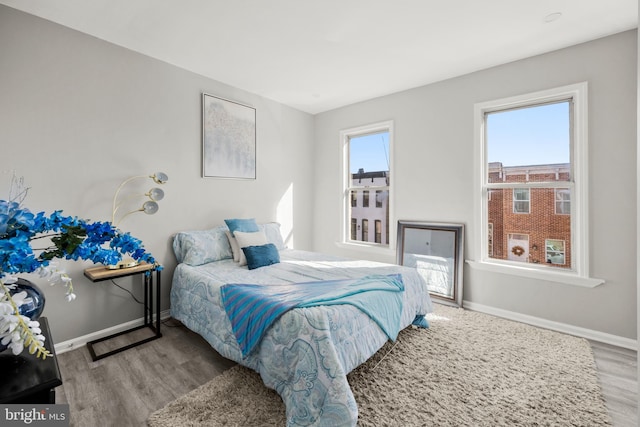 bedroom with light wood-type flooring