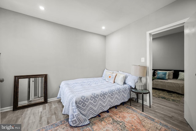 bedroom with wood-type flooring