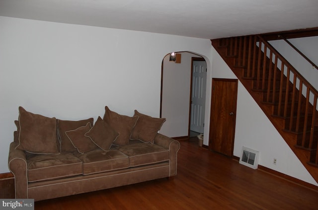 living room with dark hardwood / wood-style flooring