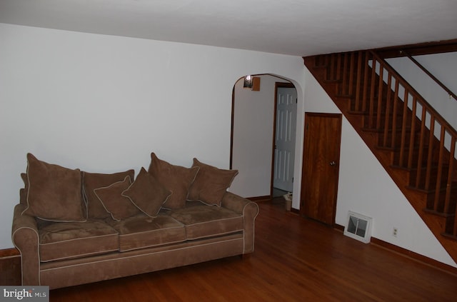 61 S Carl Ave, Greencastle, PA 17225 - living area featuring arched walkways, wood finished floors, stairs, and baseboards