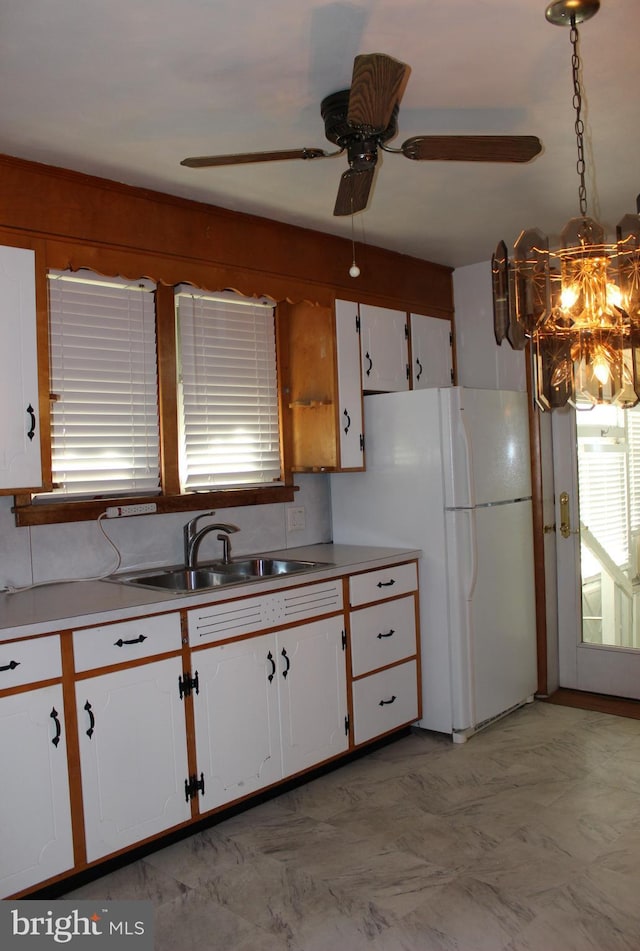 61 S Carl Ave, Greencastle, PA 17225 - kitchen with a sink, white cabinetry, ceiling fan, freestanding refrigerator, and light countertops