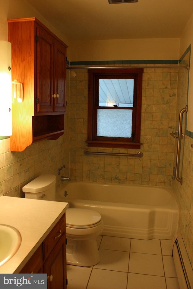 61 S Carl Ave, Greencastle, PA 17225 - full bath with a baseboard heating unit, tile patterned flooring, tile walls, toilet, and vanity