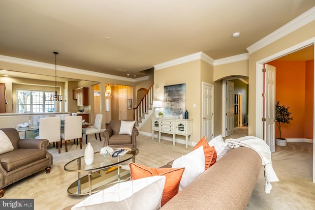 living room with light colored carpet, an inviting chandelier, and ornamental molding