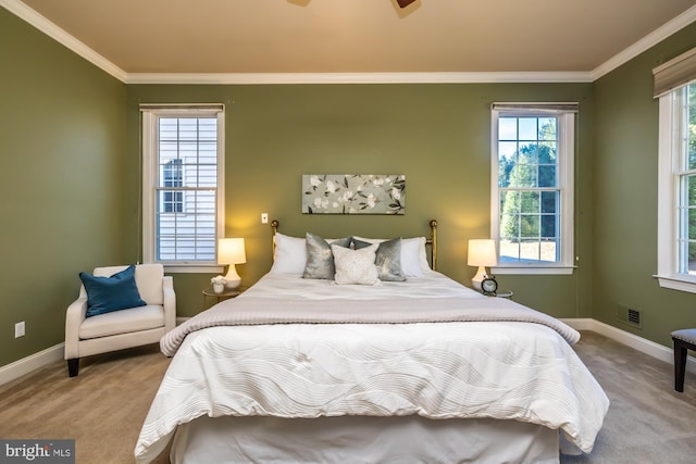 bedroom with ceiling fan, light colored carpet, and crown molding