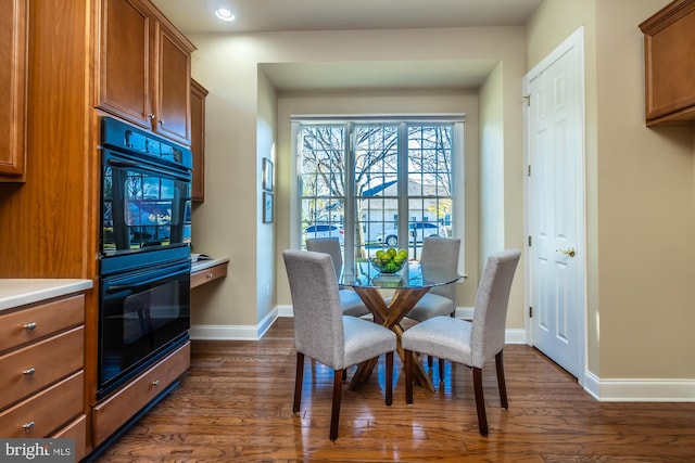 dining room with dark wood-type flooring