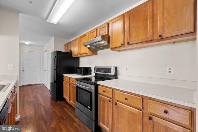 kitchen featuring stainless steel electric range oven and dark hardwood / wood-style floors