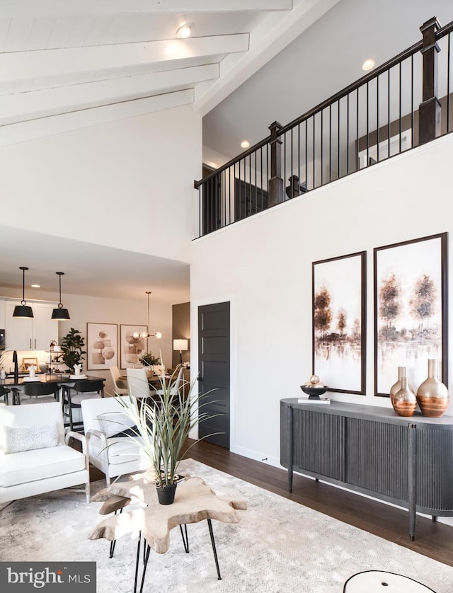 living room featuring high vaulted ceiling, beamed ceiling, and dark hardwood / wood-style floors