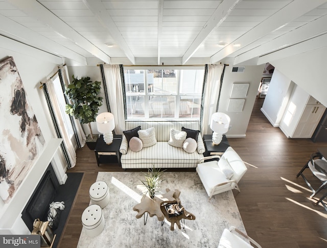 living room featuring dark wood-type flooring, beamed ceiling, and wood ceiling