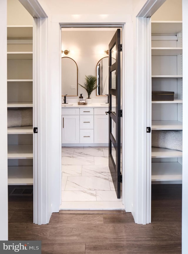 bathroom with vanity and hardwood / wood-style floors