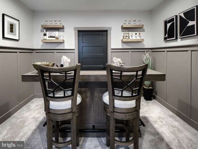 dining space featuring carpet