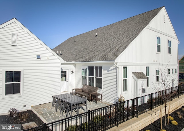 back of house with a patio