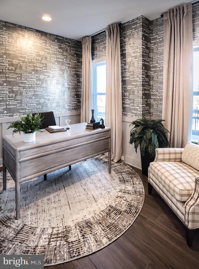 home office with a wealth of natural light and wood-type flooring