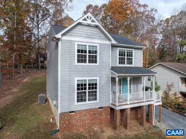 view of front facade with cooling unit and covered porch