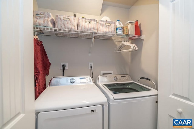 clothes washing area featuring washer and clothes dryer