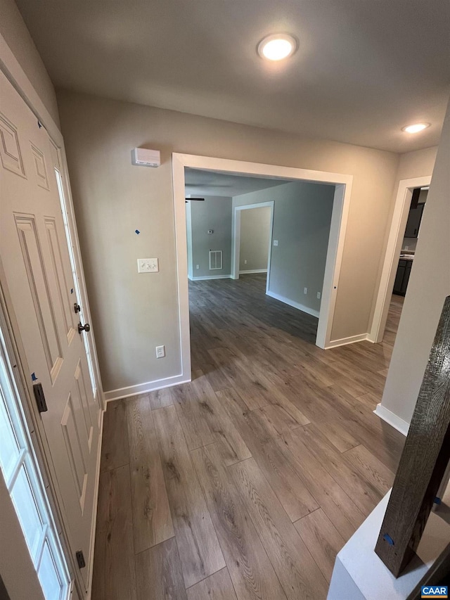 foyer entrance featuring hardwood / wood-style floors