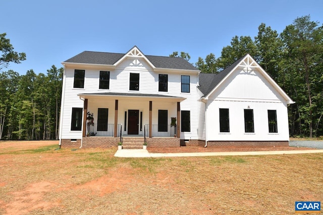 view of front of house featuring a porch and a front yard