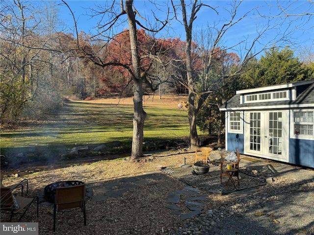 view of yard with french doors