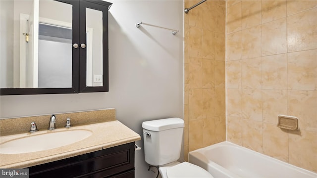 full bathroom featuring toilet, vanity, and tiled shower / bath