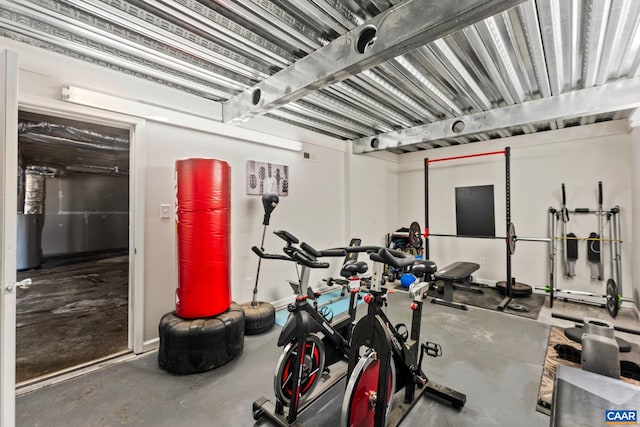 workout room featuring concrete flooring