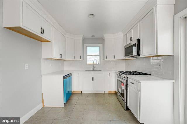 kitchen featuring white cabinets, light tile patterned floors, sink, and appliances with stainless steel finishes