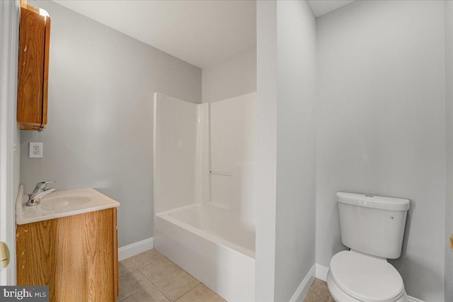 full bathroom featuring tile patterned floors, vanity, tub / shower combination, and toilet