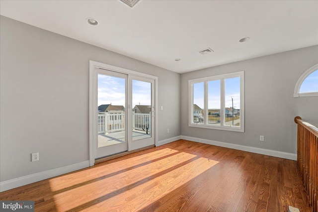 interior space with hardwood / wood-style flooring and a wealth of natural light