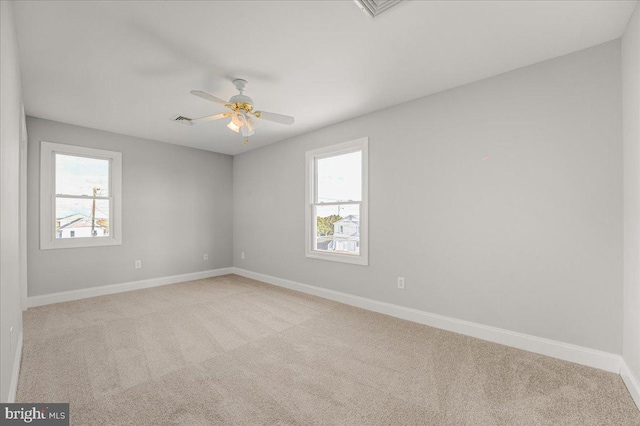 empty room with light carpet and ceiling fan