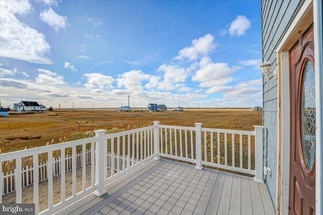 wooden terrace with a rural view