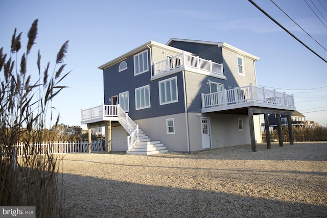 back of property with a balcony