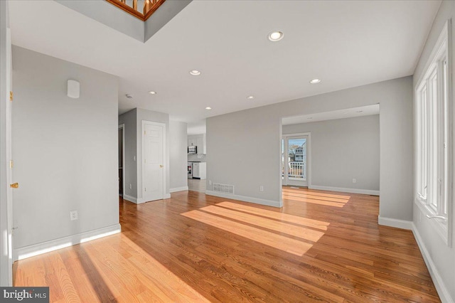 unfurnished living room featuring light wood-type flooring