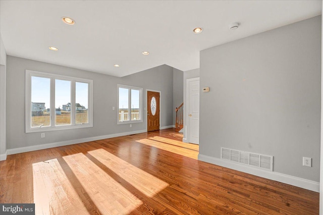 unfurnished living room featuring light hardwood / wood-style flooring