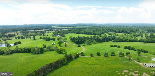 birds eye view of property with a rural view