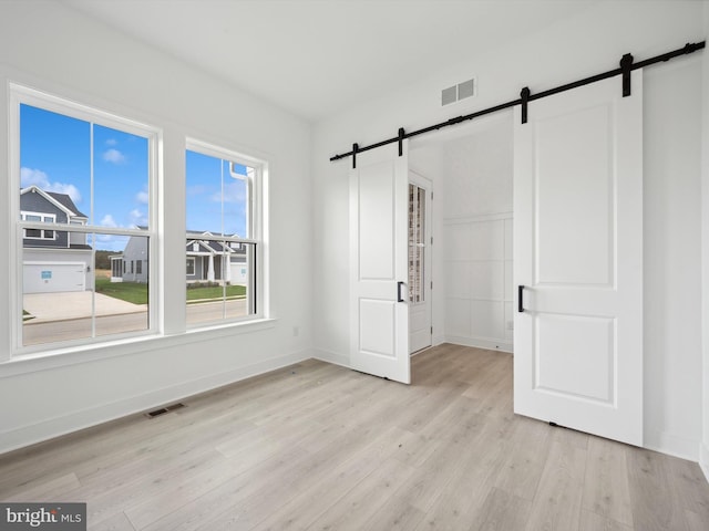 unfurnished bedroom with light hardwood / wood-style flooring