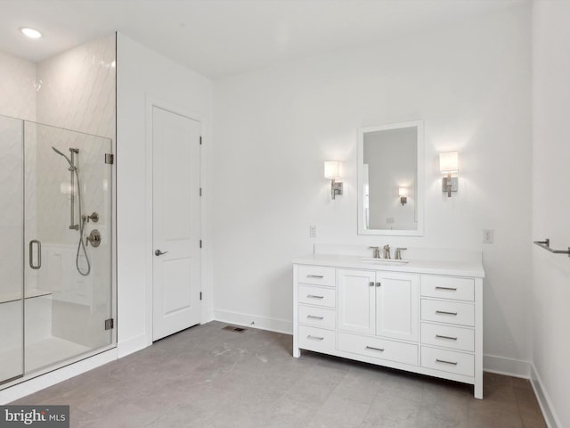 bathroom with vanity and an enclosed shower