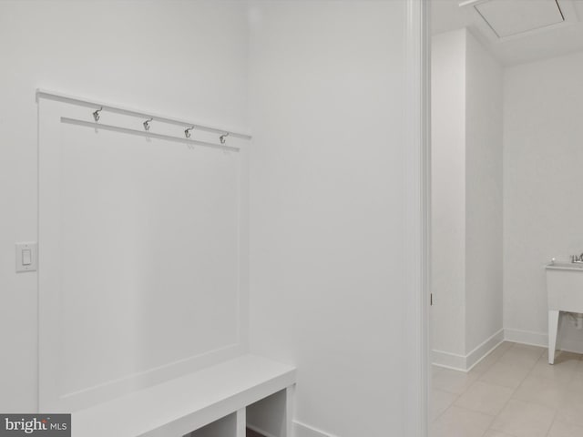 mudroom with light tile patterned flooring