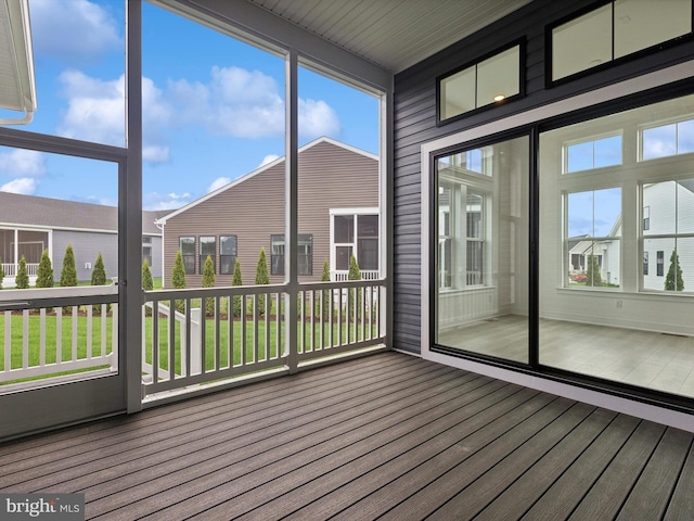 unfurnished sunroom featuring a healthy amount of sunlight