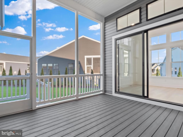 unfurnished sunroom with plenty of natural light