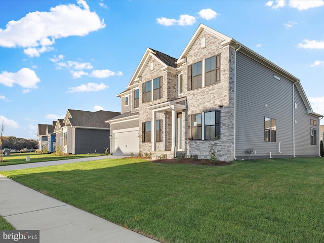 view of front of home featuring a front yard and a garage