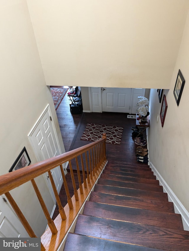 stairs with wood-type flooring