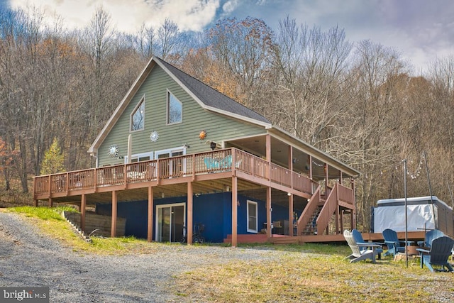 rear view of house with a deck