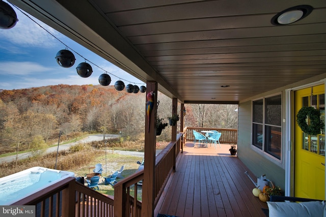 deck with a hot tub