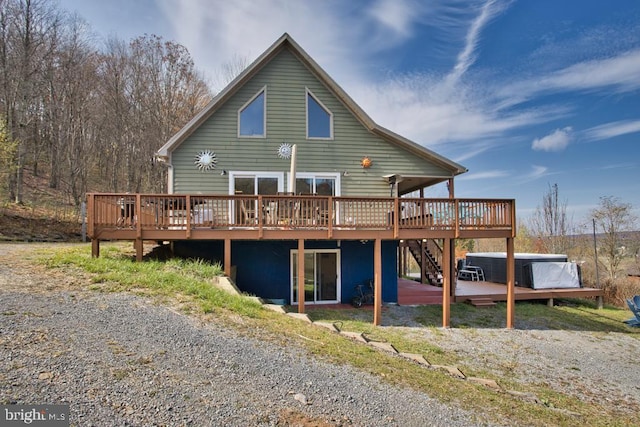 rear view of house featuring a deck