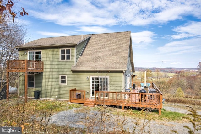 rear view of house with a deck